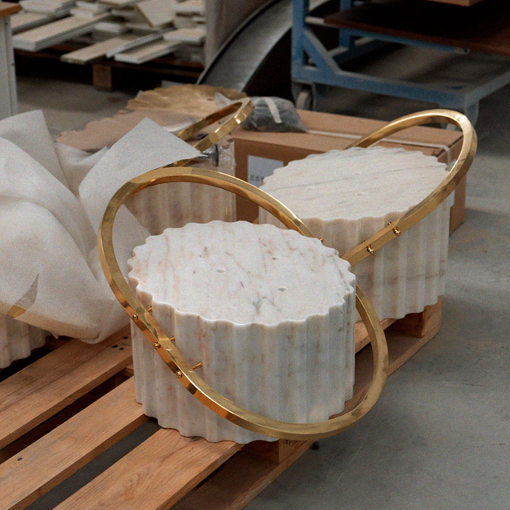 Flahy Bar Stool base featuring marble and polished brass.