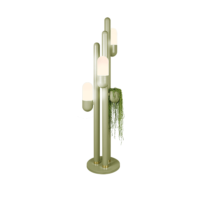 Cactus floor lamp lacquered in olive, with its three lampshades turned on and featuring a hanging succulent.