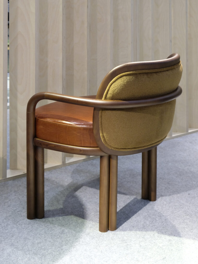 James Dining Chair James Dining Chair with a smoked walnut wood frame, upholstered in red leather with a contrasting yellow velvet backrest