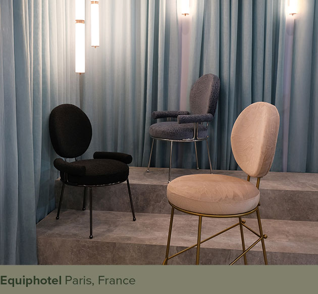 Brigid I and Brigid II dining chairs along with the Brigid bar chair, placed next to Miami lamps in a blue setting at EquipHotel Paris.