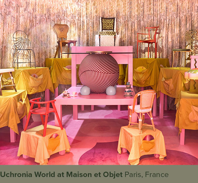 Circulus dining table with striped fabric and blue sphere legs, displayed at Uchronia World during Maison et Objet.