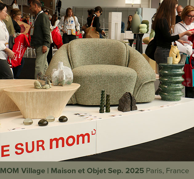 Romy armchair displayed at the MOM Village during Maison&Objet 2025, upholstered in green fabric.