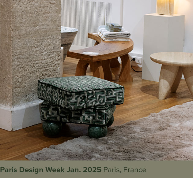 Madonna stool upholstered in green patterned fabric with Verde Guatemala marble sphere feet, displayed at Paris Design Week in France.